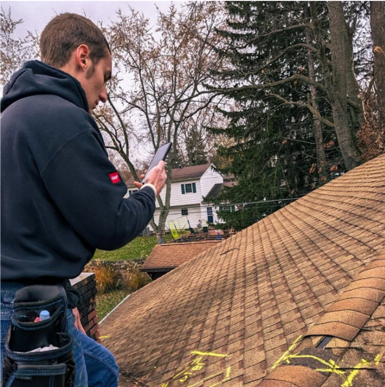 Mitchell Davis - DTE Roofing Owner performing roof inspection